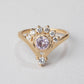 pink sapphire gold ring with a diamond crown