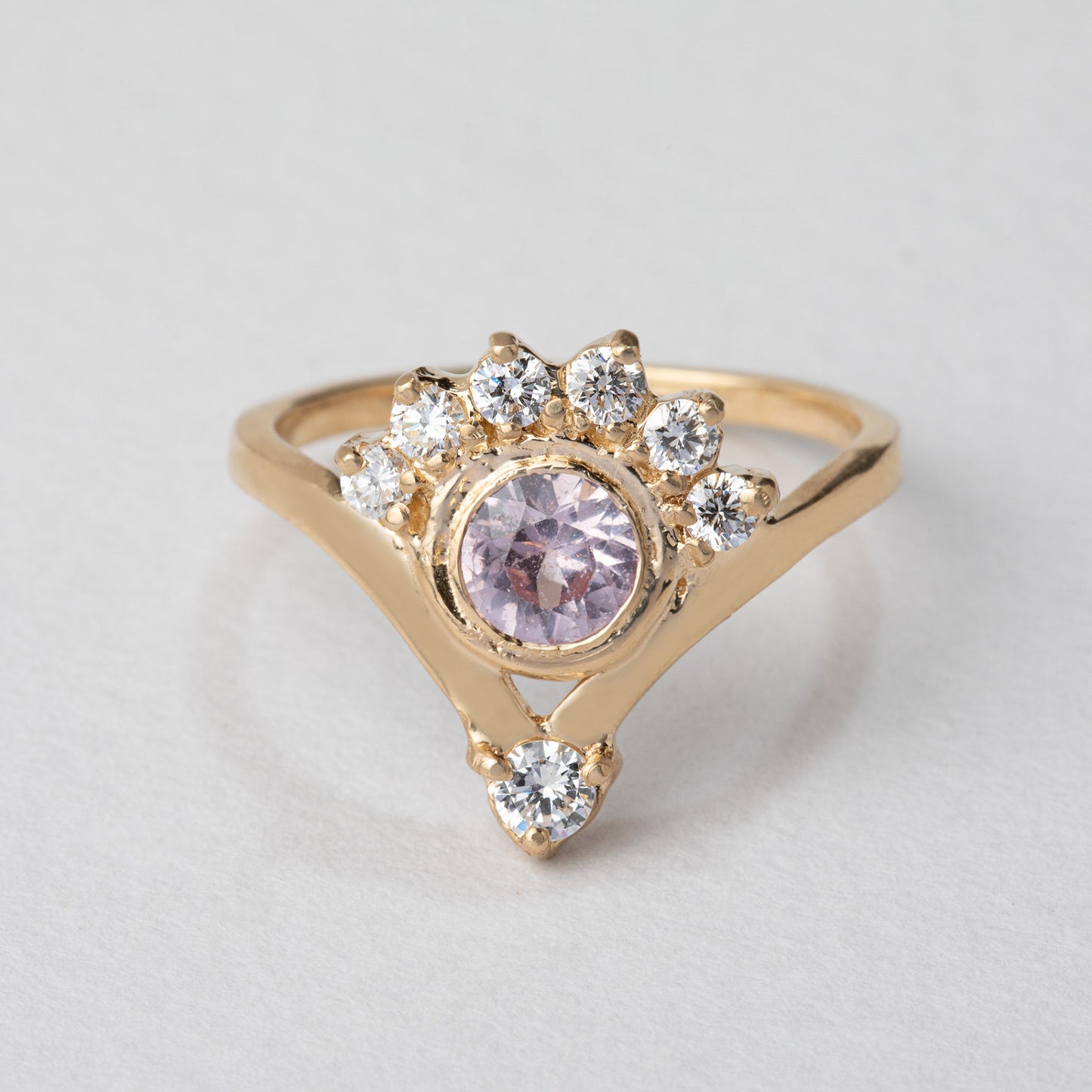 pink sapphire gold ring with a diamond crown