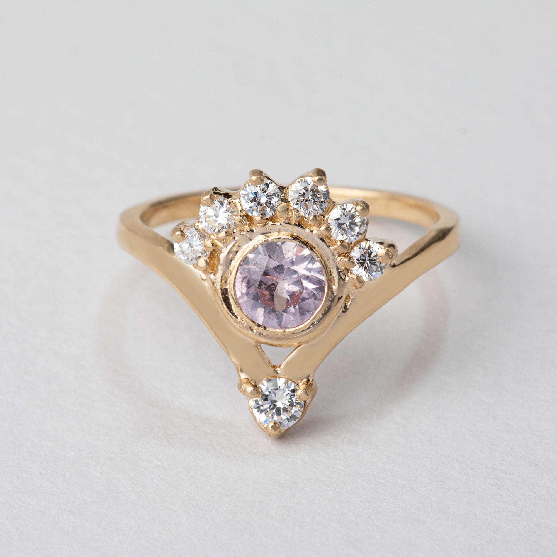 pink sapphire gold ring with a diamond crown