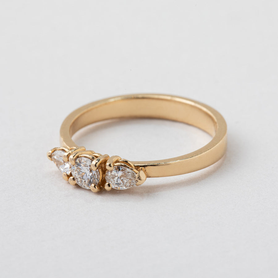 gold band set with three diamonds