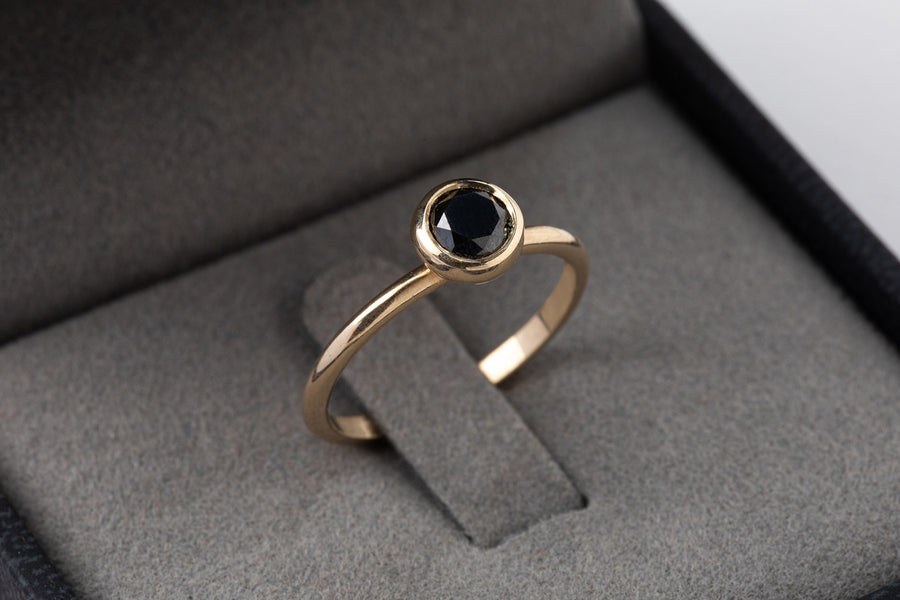 14k gold ring set with a 5mm black diamond