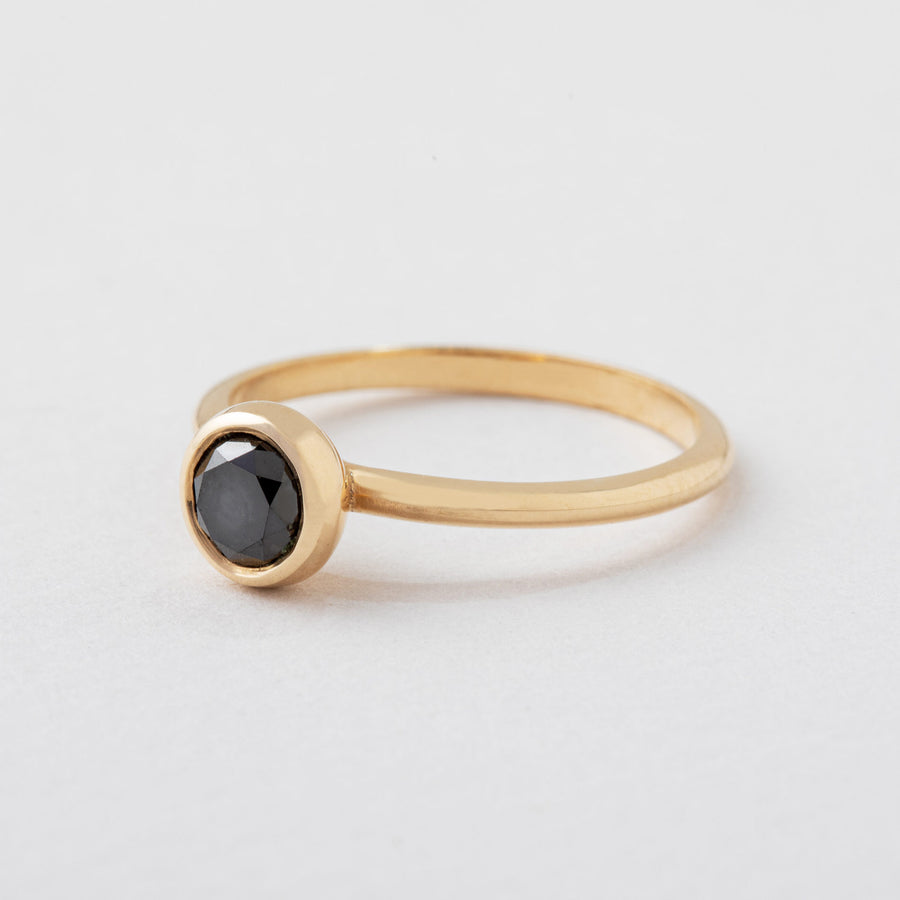 classic gold ring with edgy black diamond.